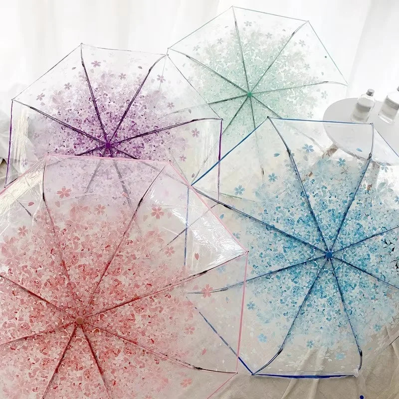 This transparent cherry blossom umbrella features a stylish and unique three-fold design presenting a fresh and simple aesthetic