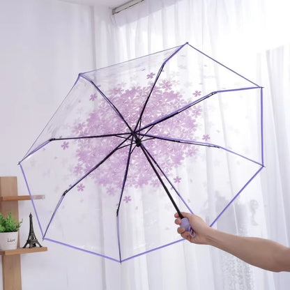 This transparent cherry blossom umbrella features a stylish and unique three-fold design presenting a fresh and simple aesthetic