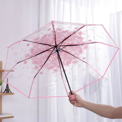This transparent cherry blossom umbrella features a stylish and unique three-fold design presenting a fresh and simple aesthetic