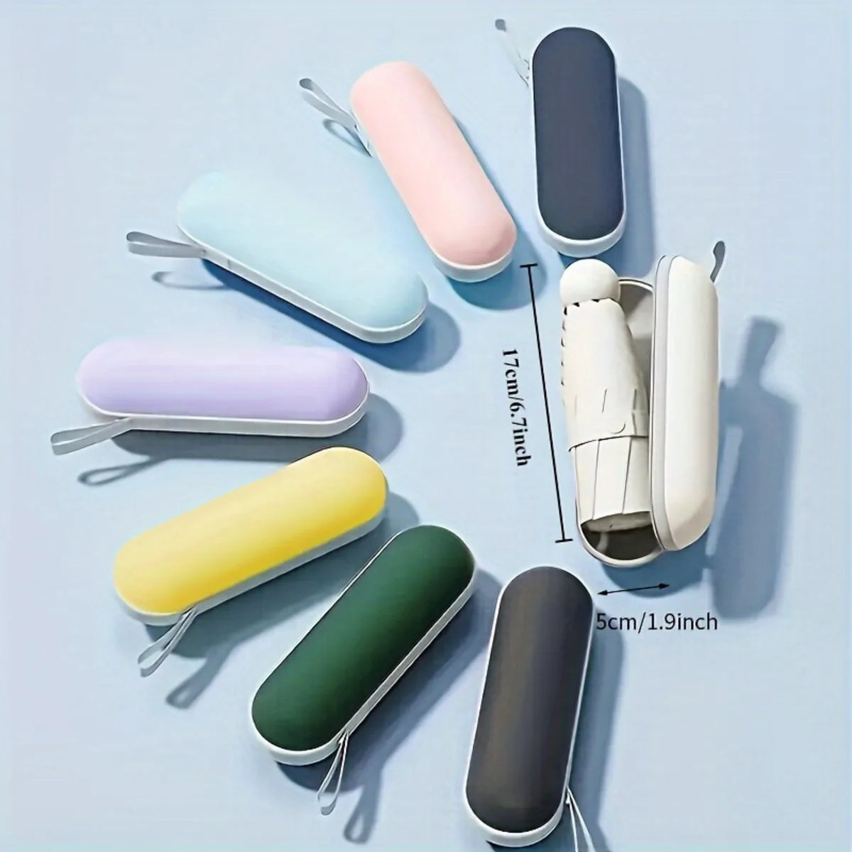 Compact black mini capsule umbrella - portable, foldable, manually open, with sun protection coating, durable design with