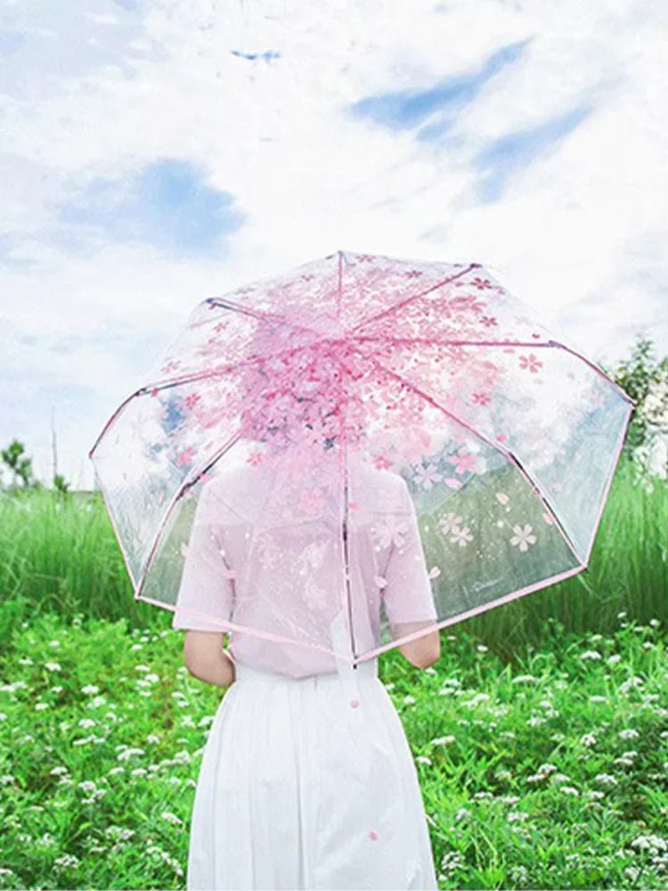 This transparent cherry blossom umbrella features a stylish and unique three-fold design presenting a fresh and simple aesthetic